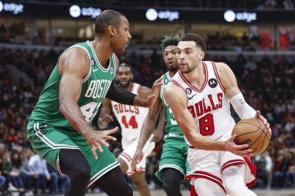 Nov 21, 2022; Chicago, Illinois, USA; Chicago Bulls guard Zach LaVine (8) moves to the basket against Boston Celtics center Al Horford (42) during the first half at United Center. Mandatory Credit: Kamil Krzaczynski-USA TODAY Sports