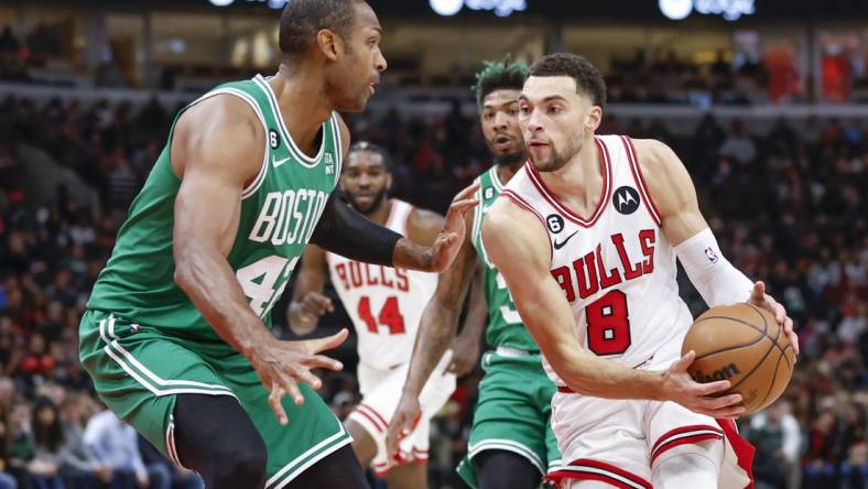 Nov 21, 2022; Chicago, Illinois, USA; Chicago Bulls guard Zach LaVine (8) moves to the basket against Boston Celtics center Al Horford (42) during the first half at United Center. Mandatory Credit: Kamil Krzaczynski-USA TODAY Sports