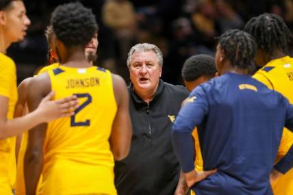 Nov 18, 2022; Morgantown, West Virginia, USA; West Virginia Mountaineers head coach Bob Huggins talks to his team during the second half against the Pennsylvania Quakers at WVU Coliseum. Mandatory Credit: Ben Queen-USA TODAY Sports