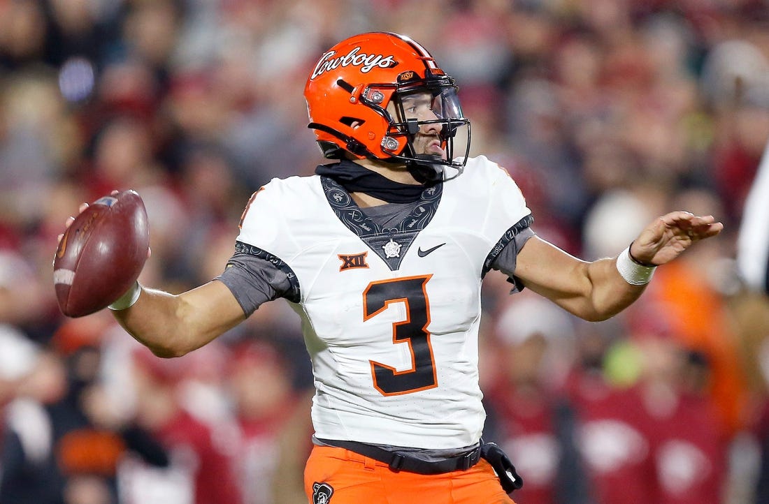 Oklahoma State's Spencer Sanders (3) looks to throw a pass in the first half during the Bedlam college football game between the University of Oklahoma Sooners (OU) and the Oklahoma State University Cowboys (OSU) at Gaylord Family-Oklahoma Memorial Stadium, in Norman, Okla., Saturday, Nov., 19, 2022.

cover main