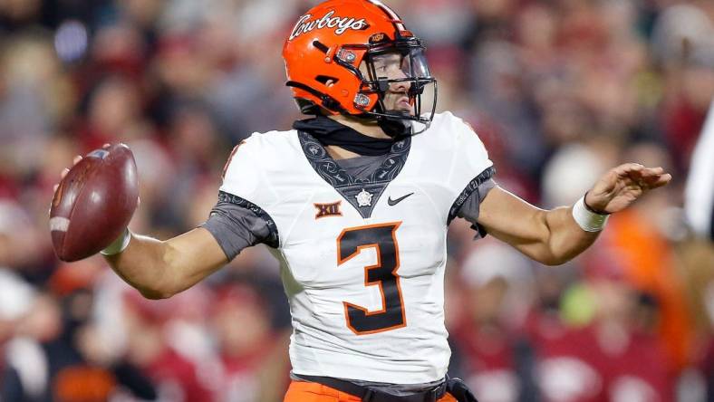 Oklahoma State's Spencer Sanders (3) looks to throw a pass in the first half during the Bedlam college football game between the University of Oklahoma Sooners (OU) and the Oklahoma State University Cowboys (OSU) at Gaylord Family-Oklahoma Memorial Stadium, in Norman, Okla., Saturday, Nov., 19, 2022.

cover main