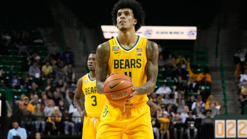 Nov 23, 2022; Waco, Texas, USA;  Baylor Bears forward Jalen Bridges (11) shoots a free throw against the McNeese State Cowboys during the second half at Ferrell Center. Mandatory Credit: Chris Jones-USA TODAY Sports