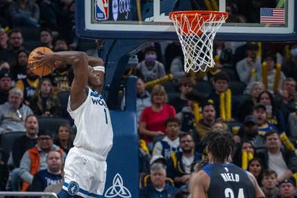 Nov 23, 2022; Indianapolis, Indiana, USA; Minnesota Timberwolves guard Anthony Edwards (1) slam dunks the ball in the second half against the Indiana Pacers at Gainbridge Fieldhouse. Mandatory Credit: Trevor Ruszkowski-USA TODAY Sports