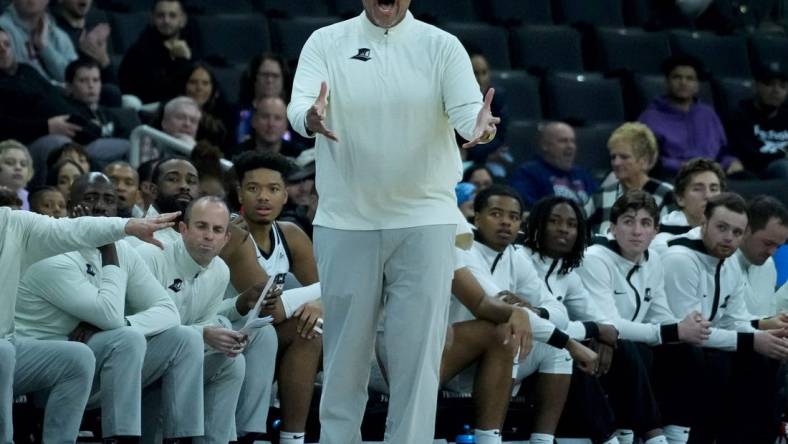 Providence College coach Ed Cooley expression his frustration of a call against the Friars from the bench.