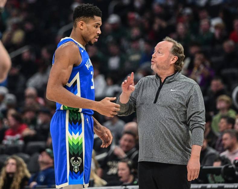 Nov 23, 2022; Milwaukee, Wisconsin, USA; Milwaukee Bucks forward Giannis Antetokounmpo (34) talks to head coach Mike Budenholzer in the first quarter during game against the Chicago Bulls at Fiserv Forum. Mandatory Credit: Benny Sieu-USA TODAY Sports