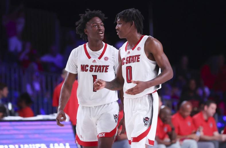 Nov 24, 2022; Paradise Island, BAHAMAS; North Carolina State Wolfpack guard Jarkel Joiner (1) laughs with North Carolina State Wolfpack guard Terquavion Smith (0) during the second half against the Dayton Flyers at Imperial Arena. Mandatory Credit: Kevin Jairaj-USA TODAY Sports