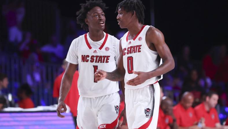 Nov 24, 2022; Paradise Island, BAHAMAS; North Carolina State Wolfpack guard Jarkel Joiner (1) laughs with North Carolina State Wolfpack guard Terquavion Smith (0) during the second half against the Dayton Flyers at Imperial Arena. Mandatory Credit: Kevin Jairaj-USA TODAY Sports