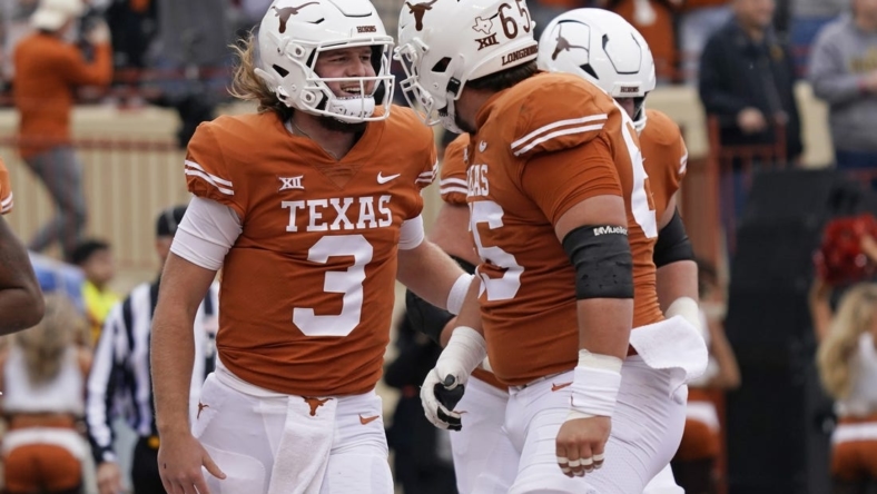 Nov 25, 2022; Austin, Texas, USA; Texas Longhorns quarterback Quinn Ewers (3) reacts after running in to the end zone for touchdown during the first half against the Baylor Bears at Darrell K Royal-Texas Memorial Stadium. Mandatory Credit: Scott Wachter-USA TODAY Sports