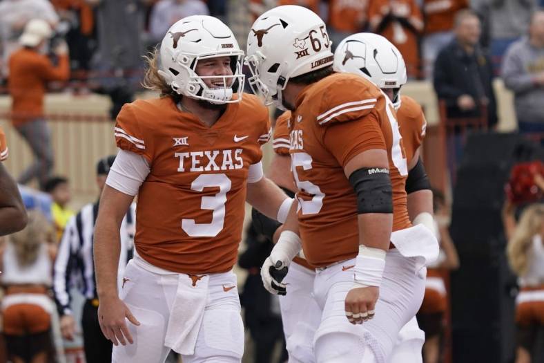 Nov 25, 2022; Austin, Texas, USA; Texas Longhorns quarterback Quinn Ewers (3) reacts after running in to the end zone for touchdown during the first half against the Baylor Bears at Darrell K Royal-Texas Memorial Stadium. Mandatory Credit: Scott Wachter-USA TODAY Sports