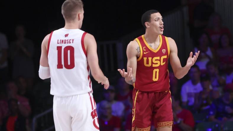 Nov 25, 2022; Paradise Island, BAHAMAS; USC Trojans forward Kobe Johnson (0) reacts in front of Wisconsin Badgers guard Isaac Lindsey (10) during the second half at Imperial Arena. Mandatory Credit: Kevin Jairaj-USA TODAY Sports