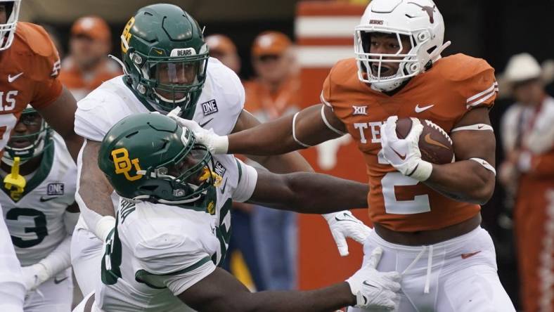 Nov 25, 2022; Austin, Texas, USA; Texas Longhorns running back Roschon Johnson (2) runs for yards during the first half against the Baylor Bears at Darrell K Royal-Texas Memorial Stadium. Mandatory Credit: Scott Wachter-USA TODAY Sports