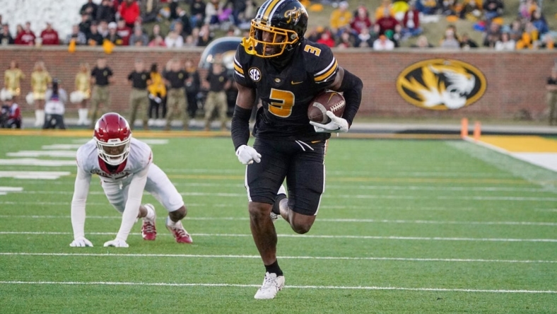 Nov 25, 2022; Columbia, Missouri, USA; Missouri Tigers wide receiver Dominic Lovett (7) runs in for a touchdown against Arkansas Razorbacks during the second half at Faurot Field at Memorial Stadium. Mandatory Credit: Denny Medley-USA TODAY Sports