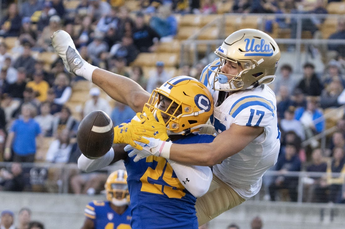 November 25, 2022; Berkeley, California, USA; UCLA Bruins wide receiver Logan Loya (17) and California Golden Bears cornerback Jeremiah Earby (29) go for the football during the third quarter at California Memorial Stadium. Mandatory Credit: Kyle Terada-USA TODAY Sports