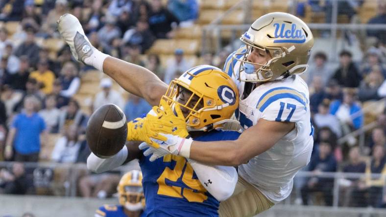 November 25, 2022; Berkeley, California, USA; UCLA Bruins wide receiver Logan Loya (17) and California Golden Bears cornerback Jeremiah Earby (29) go for the football during the third quarter at California Memorial Stadium. Mandatory Credit: Kyle Terada-USA TODAY Sports