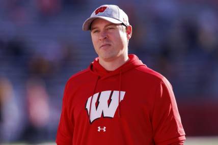 Nov 26, 2022; Madison, Wisconsin, USA;  Wisconsin Badgers head coach Jim Leonhard looks on during warmups prior to the game against the Minnesota Golden Gophers at Camp Randall Stadium. Mandatory Credit: Jeff Hanisch-USA TODAY Sports