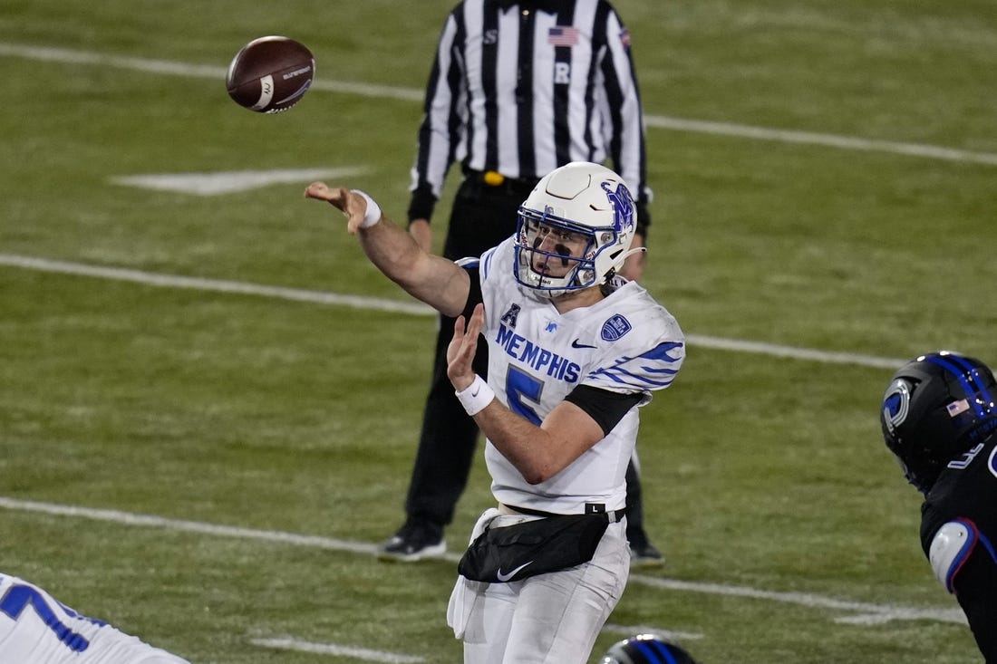 Nov 26, 2022; Dallas, Texas, USA;  Memphis Tigers quarterback Seth Henigan (5) passes the ball against the Southern Methodist Mustangs during the second half at Gerald J. Ford Stadium. Mandatory Credit: Chris Jones-USA TODAY Sports