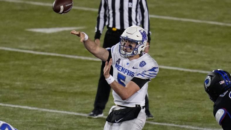 Nov 26, 2022; Dallas, Texas, USA;  Memphis Tigers quarterback Seth Henigan (5) passes the ball against the Southern Methodist Mustangs during the second half at Gerald J. Ford Stadium. Mandatory Credit: Chris Jones-USA TODAY Sports