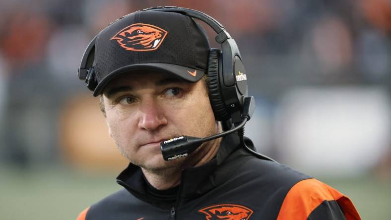 Nov 26, 2022; Corvallis, Oregon, USA; Oregon State Beavers head coach Jonathan Smith watches his team from the sidelines during the second half against the Oregon Ducks at Reser Stadium. Mandatory Credit: Soobum Im-USA TODAY Sports