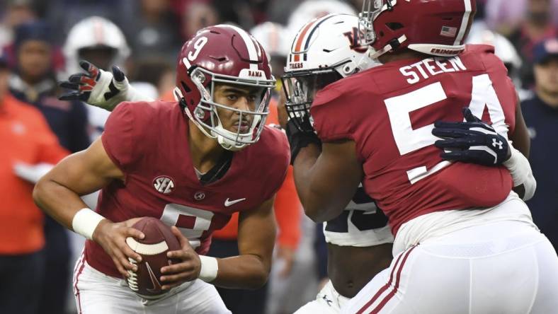 Nov 26, 2022; Tuscaloosa, Alabama, USA; Alabama Crimson Tide quarterback Bryce Young (9) drops back to pass as offensive lineman Tyler Steen (54) blocls against the Auburn Tigers at Bryant-Denny Stadium. Alabama won 49-27. Mandatory Credit: Gary Cosby Jr.-USA TODAY Sports