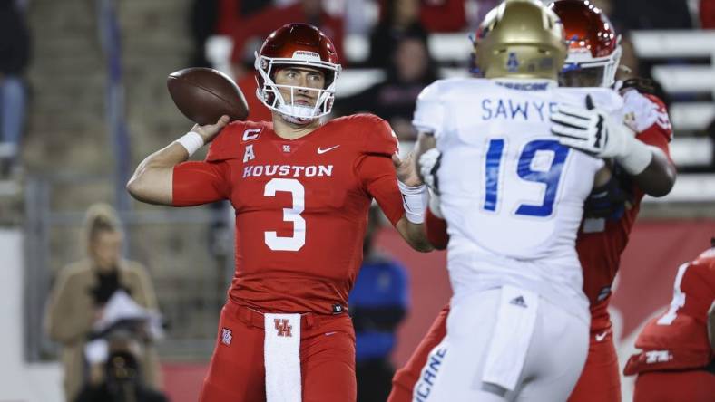 Nov 26, 2022; Houston, Texas, USA; Houston Cougars quarterback Clayton Tune (3) attempts a pass during the first quarter against the Tulsa Golden Hurricane at TDECU Stadium. Mandatory Credit: Troy Taormina-USA TODAY Sports