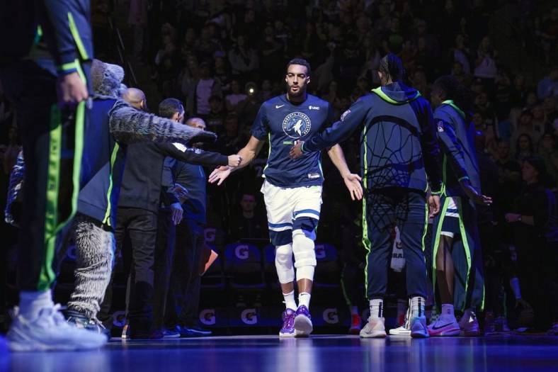 Nov 27, 2022; Minneapolis, Minnesota, USA;   Minnesota Timberwolves center Rudy Gobert (27) is introduced before a game against the Golden State Warriors at Target Center. Mandatory Credit: Nick Wosika-USA TODAY Sports