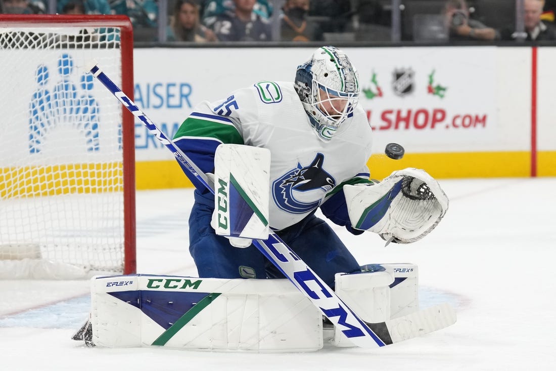 Nov 27, 2022; San Jose, California, USA; Vancouver Canucks goaltender Thatcher Demko (35) makes a save against the San Jose Sharks during the second period at SAP Center at San Jose. Mandatory Credit: Darren Yamashita-USA TODAY Sports