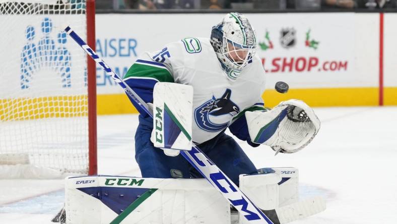 Nov 27, 2022; San Jose, California, USA; Vancouver Canucks goaltender Thatcher Demko (35) makes a save against the San Jose Sharks during the second period at SAP Center at San Jose. Mandatory Credit: Darren Yamashita-USA TODAY Sports