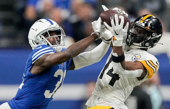 Pittsburgh Steelers wide receiver George Pickens (14) makes a catch while being guarded by Indianapolis Colts cornerback Isaiah Rodgers Sr. (34) on Monday, Nov. 28, 2022, during a game against the Pittsburgh Steelers at Lucas Oil Stadium in Indianapolis.