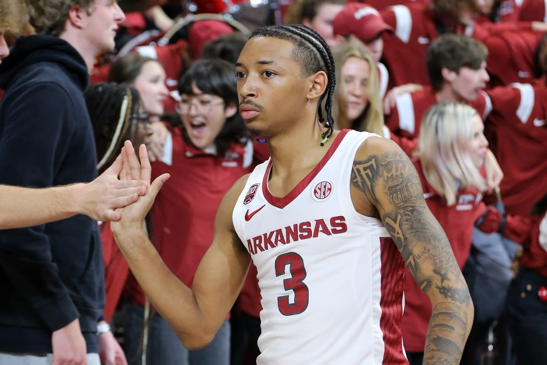 Nov 28, 2022; Fayetteville, Arkansas, USA; Arkansas Razorbacks guard Nick Smith Jr (3) celebrates with fans after the game against the Troy Trojans at Bud Walton Arena. Arkansas won 74-61. Mandatory Credit: Nelson Chenault-USA TODAY Sports