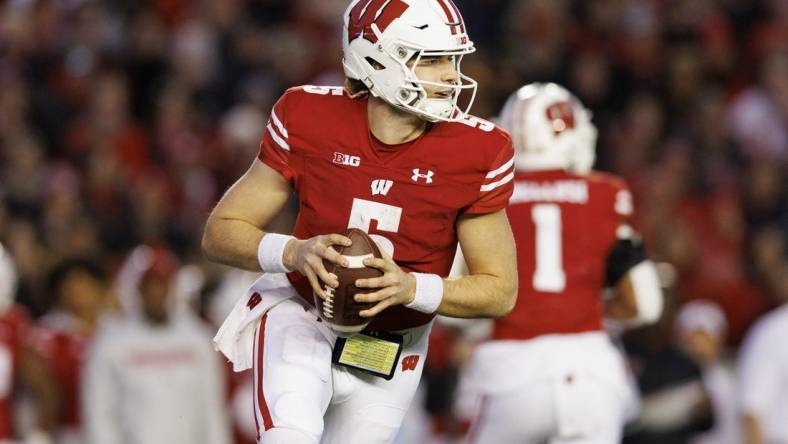 Nov 26, 2022; Madison, Wisconsin, USA;  Wisconsin Badgers quarterback Graham Mertz (5) during the game against the Minnesota Golden Gophers at Camp Randall Stadium. Mandatory Credit: Jeff Hanisch-USA TODAY Sports