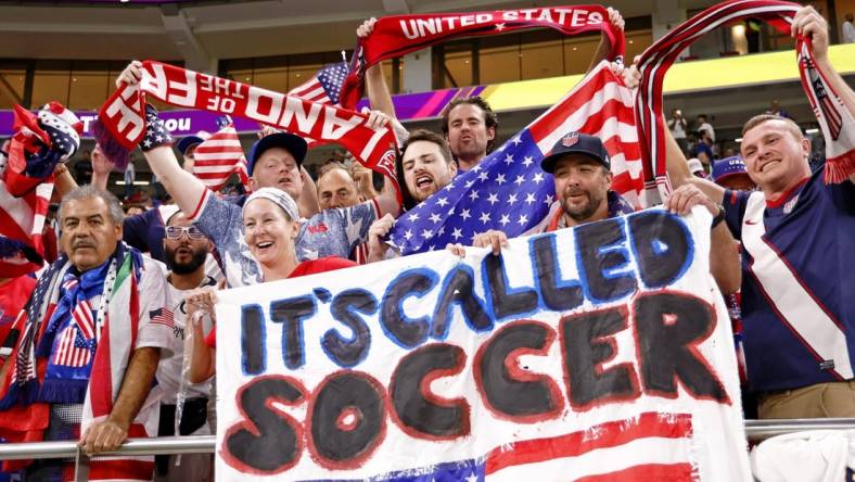 Nov 29, 2022; Doha, Qatar; United States of America fans celebrate after winning a group stage match against Iran to advance to the round of sixteen during the 2022 World Cup at Al Thumama Stadium. Mandatory Credit: Yukihito Taguchi-USA TODAY Sports