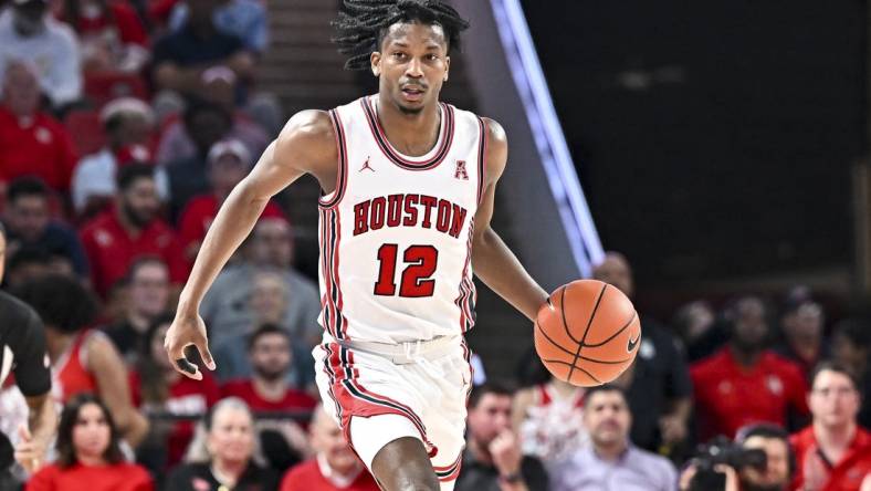 Nov 29, 2022; Houston, Texas, USA; Houston Cougars guard Tramon Mark (12) dribbles the ball during the second half against the Norfolk State Spartans at Fertitta Center. Mandatory Credit: Maria Lysaker-USA TODAY Sports