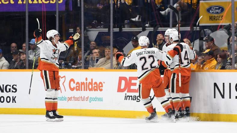 Nov 29, 2022; Nashville, Tennessee, USA; Anaheim Ducks players celerbate after a goal by right wing Troy Terry (19) during the third period against the Nashville Predators at Bridgestone Arena. Mandatory Credit: Christopher Hanewinckel-USA TODAY Sports