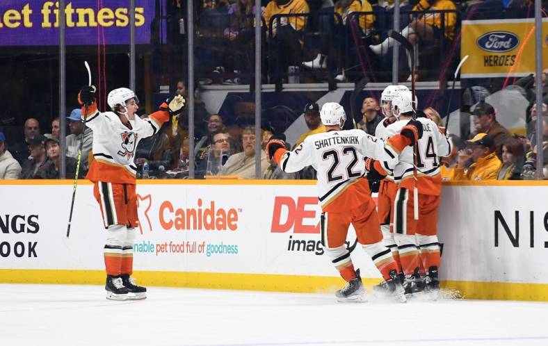 Nov 29, 2022; Nashville, Tennessee, USA; Anaheim Ducks players celerbate after a goal by right wing Troy Terry (19) during the third period against the Nashville Predators at Bridgestone Arena. Mandatory Credit: Christopher Hanewinckel-USA TODAY Sports
