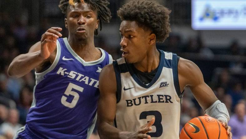 Kansas State Wildcats guard Cam Carter (5) and Butler Bulldogs guard Chuck Harris (3) under the basket at Hinkle Fieldhouse, Wednesday, Nov. 30, 2022, during Butler   s 76-64 win over Kansas State.