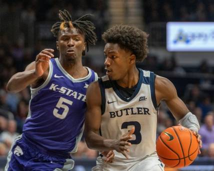 Kansas State Wildcats guard Cam Carter (5) and Butler Bulldogs guard Chuck Harris (3) under the basket at Hinkle Fieldhouse, Wednesday, Nov. 30, 2022, during Butler   s 76-64 win over Kansas State.