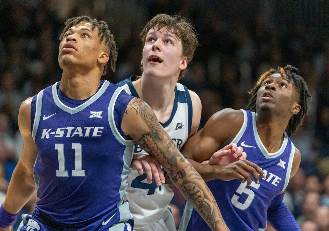 Kansas State Wildcats forward Keyontae Johnson (11), Butler Bulldogs guard Simas Lukosius (41) and Kansas State Wildcats guard Cam Carter (5) look for a rebound at Hinkle Fieldhouse, Wednesday, Nov. 30, 2022, during Butler   s 76-64 win over Kansas State.