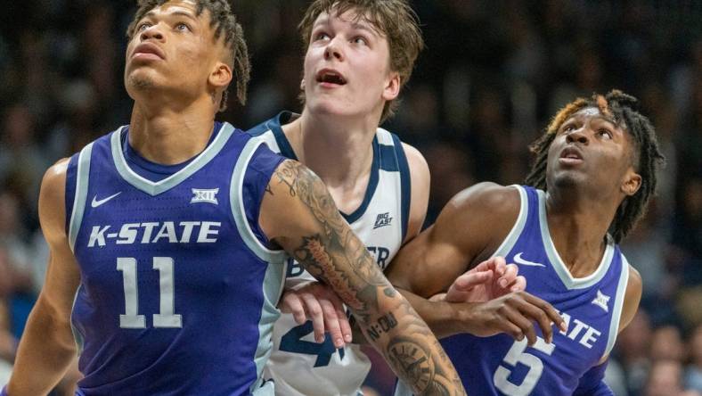 Kansas State Wildcats forward Keyontae Johnson (11), Butler Bulldogs guard Simas Lukosius (41) and Kansas State Wildcats guard Cam Carter (5) look for a rebound at Hinkle Fieldhouse, Wednesday, Nov. 30, 2022, during Butler   s 76-64 win over Kansas State.