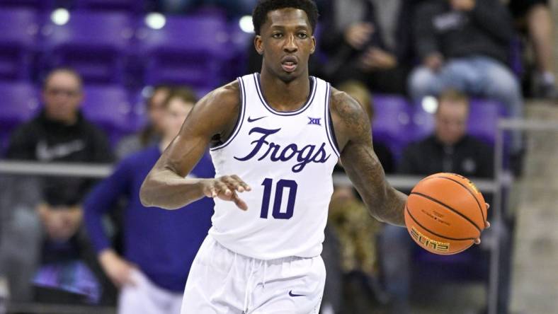 Nov 30, 2022; Fort Worth, Texas, USA; TCU Horned Frogs guard Damion Baugh (10) brings the ball up court against the Providence Friars during the first half at Ed and Rae Schollmaier Arena. Mandatory Credit: Jerome Miron-USA TODAY Sports