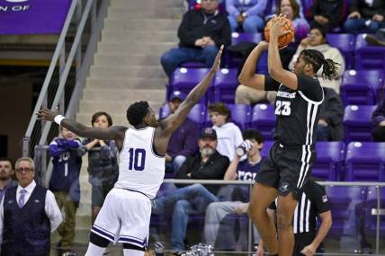 Nov 30, 2022; Fort Worth, Texas, USA; Providence Friars forward Bryce Hopkins (23) shoots over TCU Horned Frogs guard Damion Baugh (10) during the first half at Ed and Rae Schollmaier Arena. Mandatory Credit: Jerome Miron-USA TODAY Sports