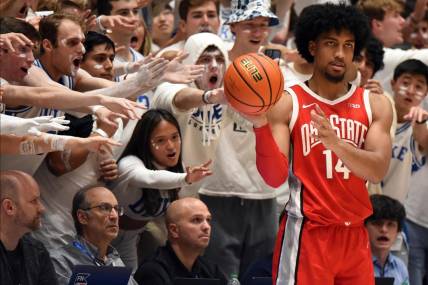 Nov 30, 2022; Durham, North Carolina, USA;  Ohio State Buckeyes forward Justice Sueing (14) plays the ball in bound in front of the Duke Blue Devils fans during the second half at Cameron Indoor Stadium.  The Blue Devils won 81-72. Mandatory Credit: Rob Kinnan-USA TODAY Sports