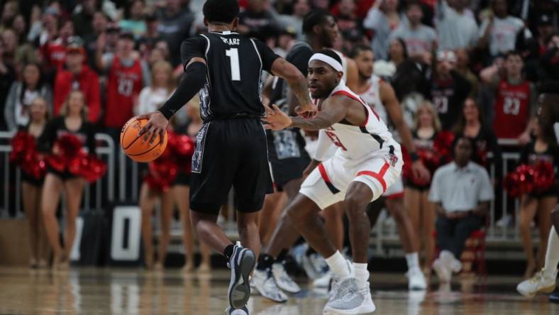 Nov 30, 2022; Lubbock, Texas, USA;  Georgetown Hoyas guard Primo Spears (1) works the ball against Texas Tech Red Raiders guard De   Vion Harmon (23) in the second half at United Supermarkets Arena. Mandatory Credit: Michael C. Johnson-USA TODAY Sports