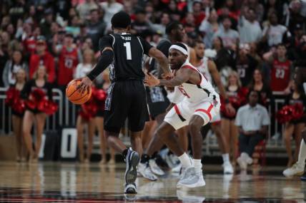 Nov 30, 2022; Lubbock, Texas, USA;  Georgetown Hoyas guard Primo Spears (1) works the ball against Texas Tech Red Raiders guard De   Vion Harmon (23) in the second half at United Supermarkets Arena. Mandatory Credit: Michael C. Johnson-USA TODAY Sports