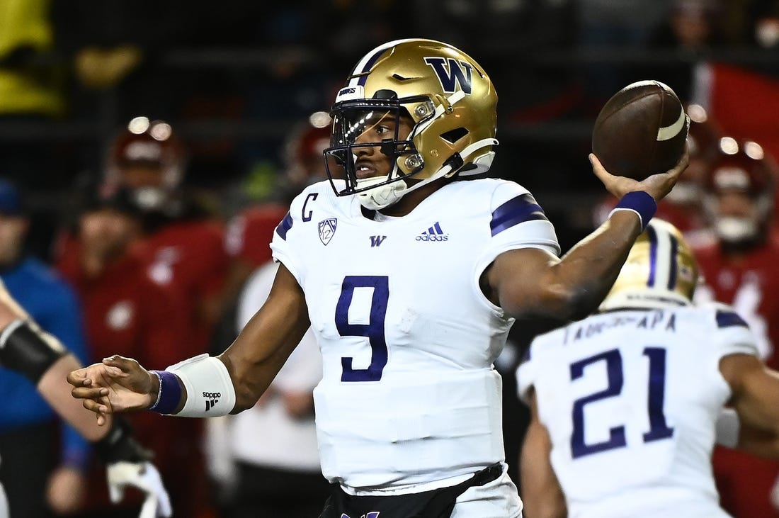 Nov 26, 2022; Pullman, Washington, USA; Washington Huskies quarterback Michael Penix Jr. (9) throws a pass against the Washington State Cougars in the second half at Gesa Field at Martin Stadium. Mandatory Credit: James Snook-USA TODAY Sports