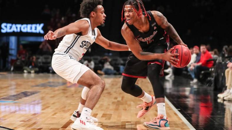 Nov 22, 2022; Brooklyn, New York, USA;  Temple Owls guard Khalif Battle (0) and Richmond Spiders guard Jason Nelson (1) at Barclays Center. Mandatory Credit: Wendell Cruz-USA TODAY Sports