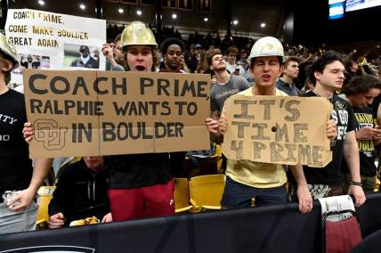 Dec 1, 2022; Boulder, Colorado, USA; Colorado Buffaloes student fans hold signs in reference to Jackson State University head coach Deion Sanders (not pictured) before the game against the Arizona State Sun Devils at the CU Events Center. Mandatory Credit: Ron Chenoy-USA TODAY Sports