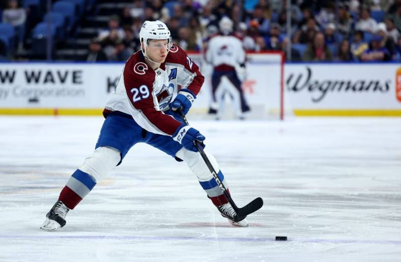Dec 1, 2022; Buffalo, New York, USA;  Colorado Avalanche center Nathan MacKinnon (29) looks to make a pass during the third period against the Buffalo Sabres at KeyBank Center. Mandatory Credit: Timothy T. Ludwig-USA TODAY Sports