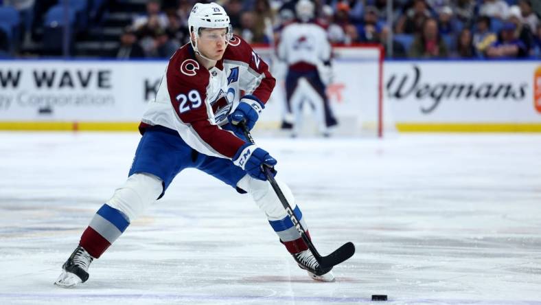 Dec 1, 2022; Buffalo, New York, USA;  Colorado Avalanche center Nathan MacKinnon (29) looks to make a pass during the third period against the Buffalo Sabres at KeyBank Center. Mandatory Credit: Timothy T. Ludwig-USA TODAY Sports