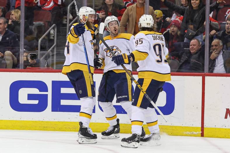 Dec 1, 2022; Newark, New Jersey, USA; Nashville Predators center Ryan Johansen (92) celebrates his overtime goal against the New Jersey Devils with teammates at Prudential Center. Mandatory Credit: Vincent Carchietta-USA TODAY Sports