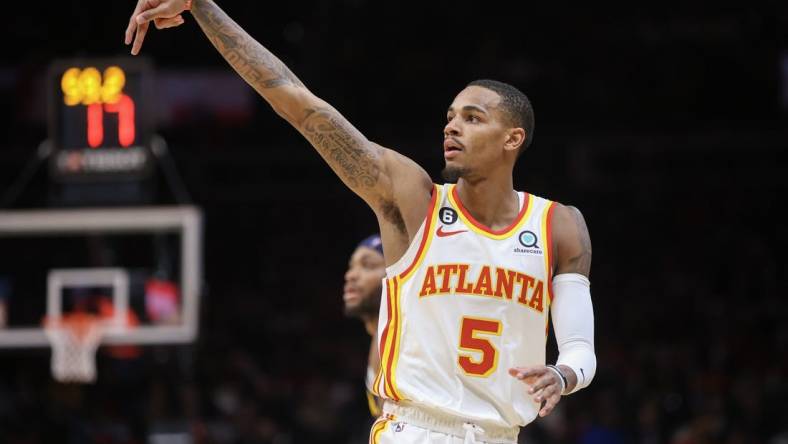 Dec 2, 2022; Atlanta, Georgia, USA; Atlanta Hawks guard Dejounte Murray (5) reacts after a three-point basket against the Denver Nuggets in the second quarter at State Farm Arena. Mandatory Credit: Brett Davis-USA TODAY Sports